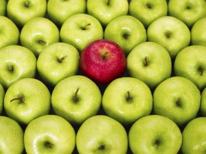 Contrast: The green apples make the red apple stand out.